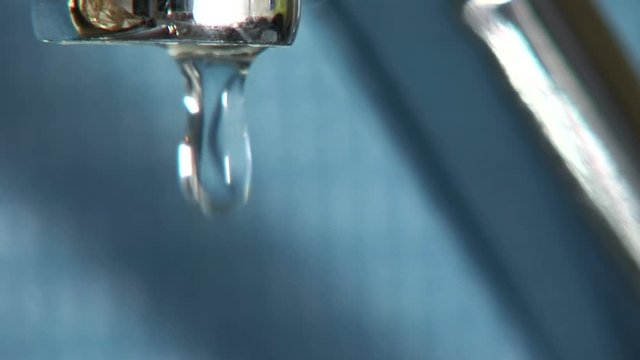 Series of macro shots of water dripping from a faucet