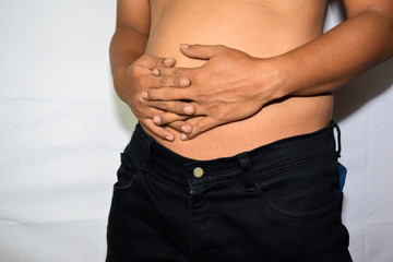 Fototapeta premium Close up Asian man get stomach pain isolated on white background