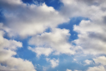 Blue sky with white sheep clouds.