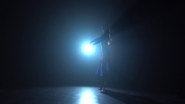 Graceful dancer girl shows modern ballet. Slow motion