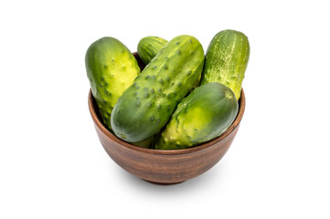 Bowl with cucumbers on white background.