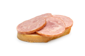 Obraz na płótnie Canvas Sandwich with sausage on white. Close up.