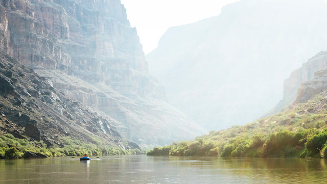 Two people in a raft on a calm stretch above Lava Rapid, Grand Canyon National Park, Arizona, USA