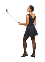 Back view of an African-American woman taking a selfie.