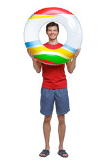 Front view of a man in shorts with an inflatable circle.