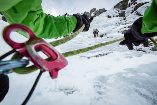 New Zealand, Otago, Wye Creek basin. A man is ice climbing on 'Slippery Customer'.