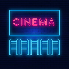 Neon lighting of the cinema. Bright advertising cinema hall. Modern vector logo, banner, shield, movie viewing pattern, chairs. Night advertising on the background of a brick wall.