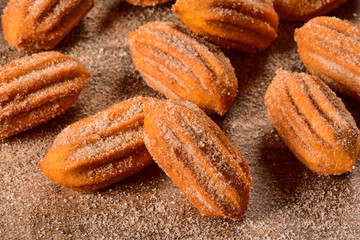 Dulce de leche churro on wooden background
