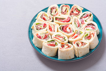 Sliced sandwich tortilla with vegetables and ham