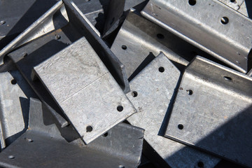 Metal parts for assembling the frame of a building under construction.