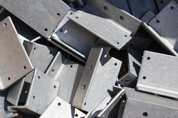Metal parts for assembling the frame of a building under construction.