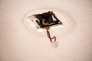 Cable laying the ceiling. Electrical wires on the wall. Wiring replacement. Connecting the light in the flat or office. Professional installation of electrical outlets, wires and switches. Insulation