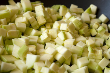 light green diced zucchini, close up view