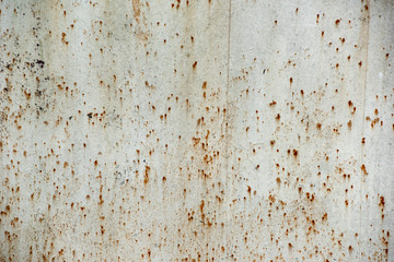 The metal sheet covered red corrosion