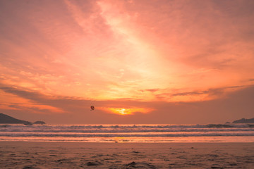 Obraz premium Sunset lovers, bright orange sky, on the beach Famous Phuket Patong Thailand