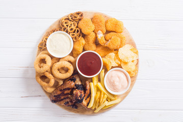 Onion rings , nuggets grilled wings , french fries and mix of snacks