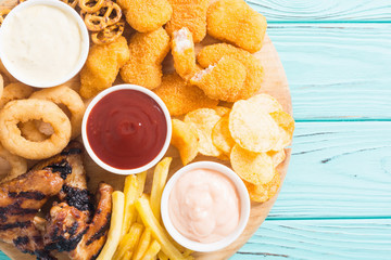 Onion rings , nuggets grilled wings , french fries and mix of snacks