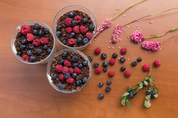 Blueberry,strawberry and raspberry Magnolia Dessert on the wooden table for concept.