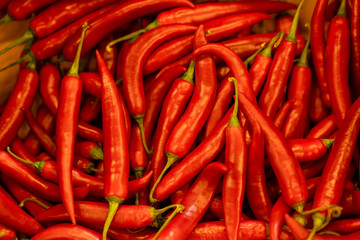 Close up background of hot red chilean pepper. Heap of pepper.
