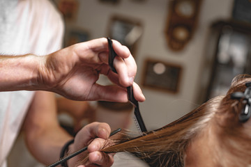 Men's beauty salon. The man makes a haircut.