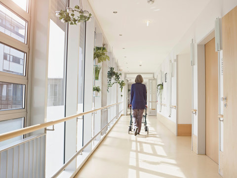 Senior woman with walking frame in nursing home