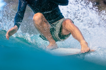 A man getting toes on the nose of a longboard while surfing at Noosa Heads, Queensland, Australia