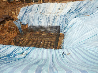Temporary slope protection during construction using the plastic sheets to prevent soil erosion by rainwater. The protection will be removed after the work done.  