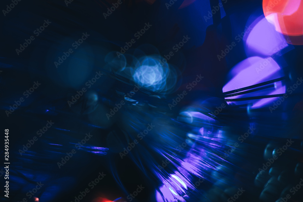 Poster beautiful abstract fiber optical network cable on a multi colored glow background.