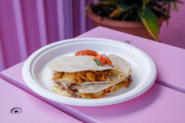 Mexican style food dish served with a colourful background