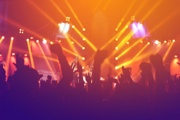 silhouettes of  , Fun concert party rock disco light background.