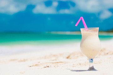 Pinacolada drink in cocktail glass on the beach