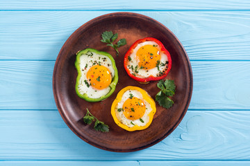Yellow , red and green pepper with fried eggs