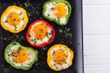 Yellow , red and green pepper with fried eggs