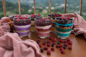 Blueberry,strawberry and raspberry Magnolia Dessert on the wooden table for concept.