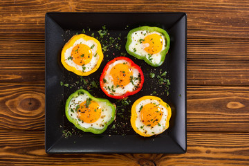 Yellow , red and green pepper with fried eggs