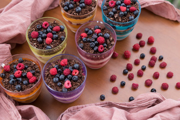 Blueberry,strawberry and raspberry Magnolia Dessert on the wooden table for concept.