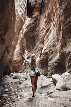 Woman traveler in amazing Avakas gorge, nature landscape, Cyprus. View of the popular canyon tourist 