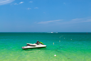 Fototapeta na wymiar Turquoise ocean jet ski scooter blue sea