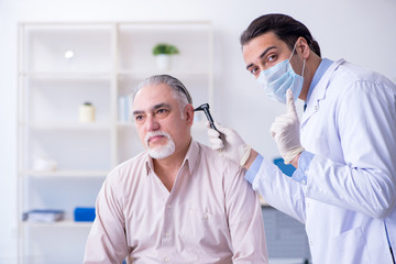 Male patient visiting doctor otolaryngologist