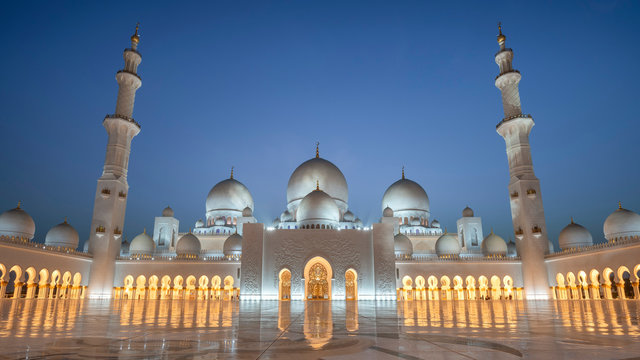Panoramic Exterior of Sheikh Zayed Mosque with lights during blue hour