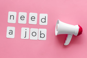 Need a job text for announcement and megaphone on pink background top view