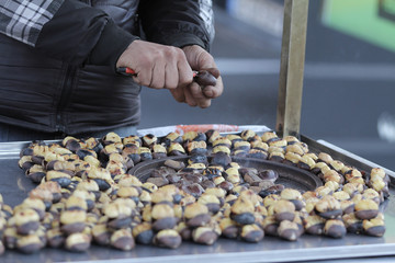  sellers selling chestnuts on the street