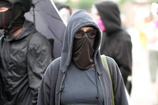 ANTIFA supporter at a protest on a nice day.