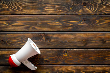 Announcement with megaphone on wooden background top view mockup