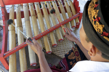 Gamelan Balinese Musicians playing wooden xylophone in Bali Indonesia