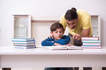 Father helping his son to prepare for school