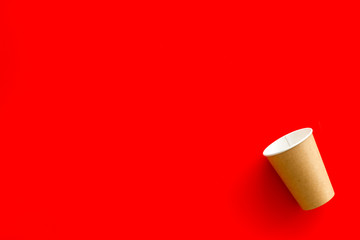 paper cups for coffee to take away on red background copyspace