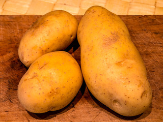Potatoes on the cutting board - selective focus