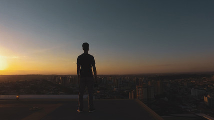 Man photographer silhouette at sunset