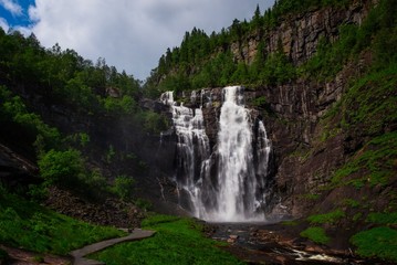 Frontal view of the Skjervsfossen in summer, seen from the base. Norway. July 2019